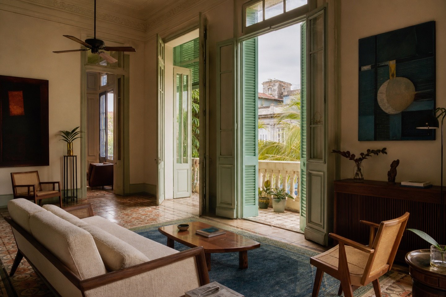 Restored Havana interior with tall green shutters and a private balcony