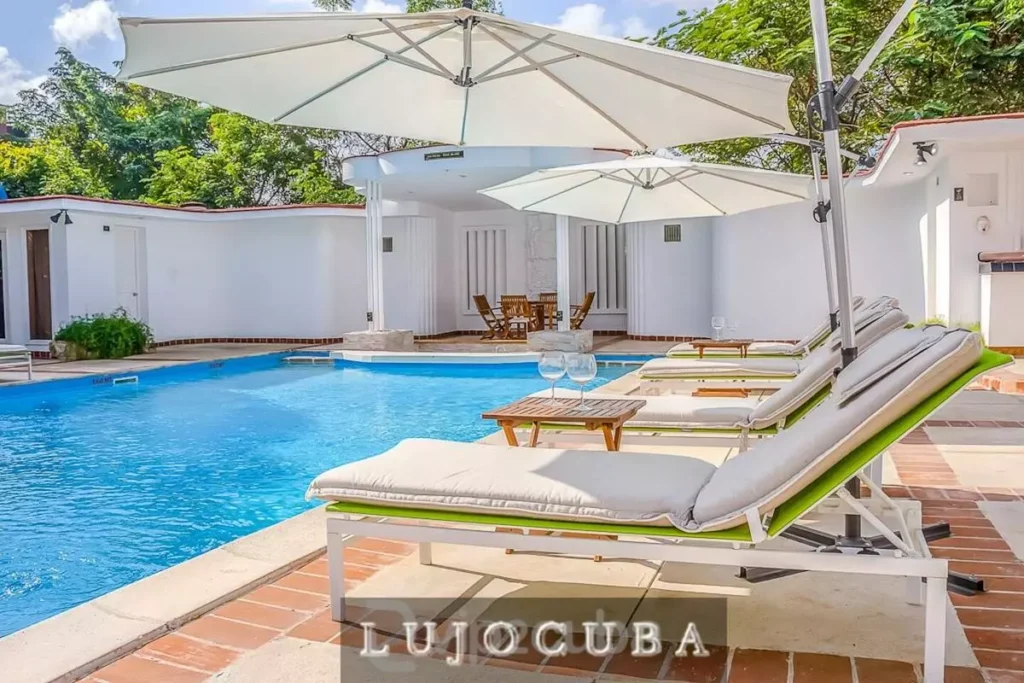 Sun loungers beside the pool at Mansion El Duque