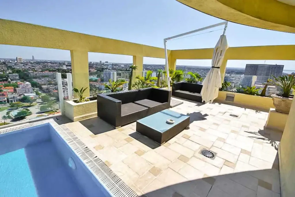 Shaded outdoor lounge beside the pool at Penthouse Atlantic City