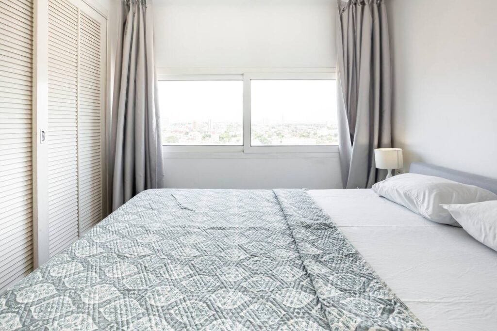 Bright bedroom with panoramic window at Penthouse Atlantic City