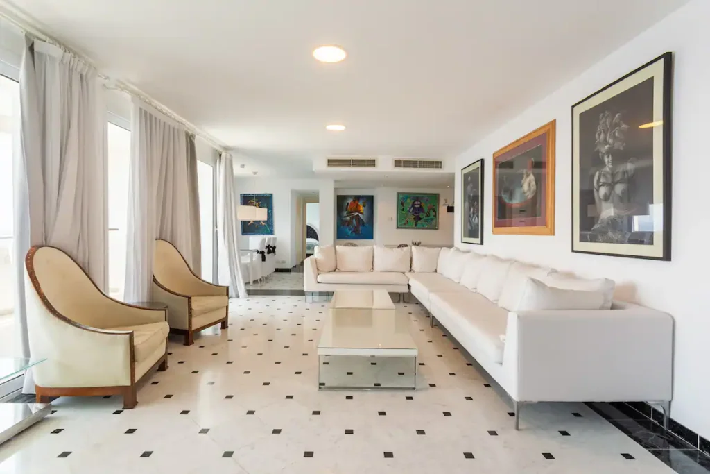 Bright main lounge with artwork at Penthouse Atlantic Sea