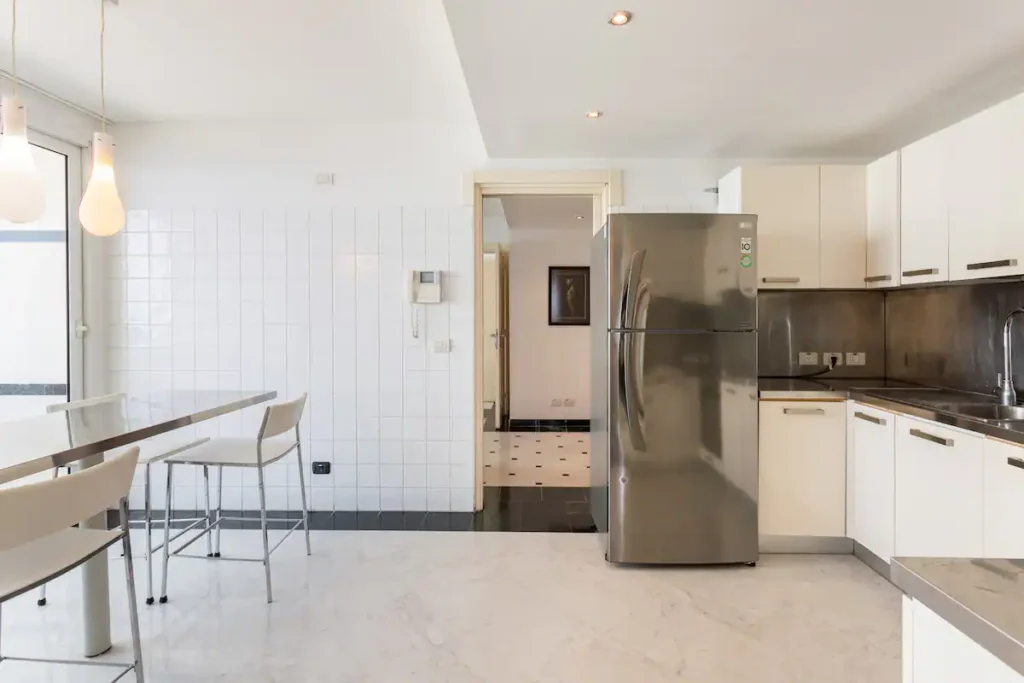 Bright kitchen with island and full-size appliances in Havana