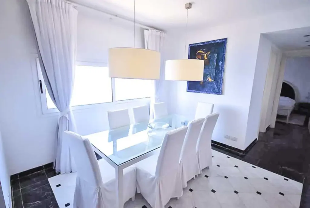 Small dining nook with blue artwork at Penthouse Atlantic Sea