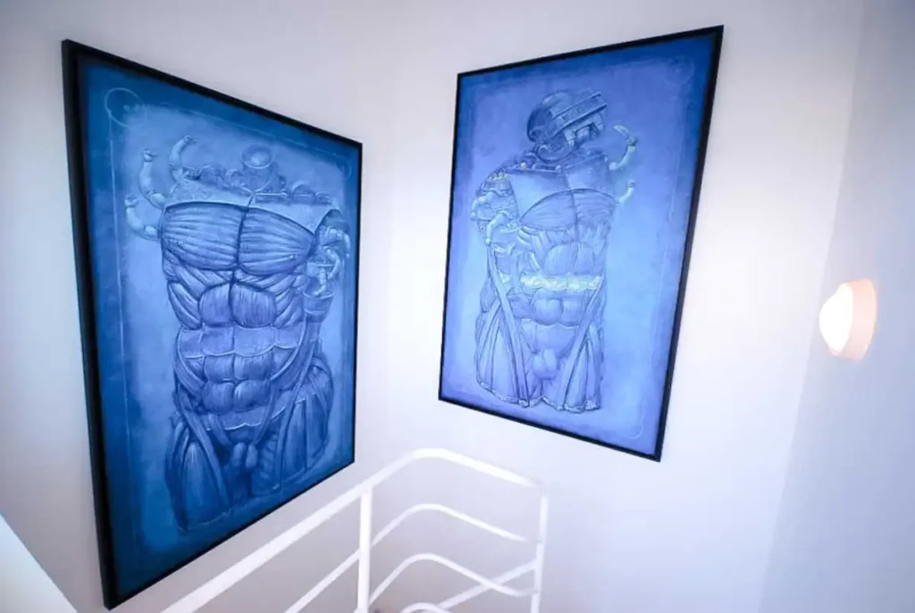 Blue artwork beside the internal staircase of the penthouse