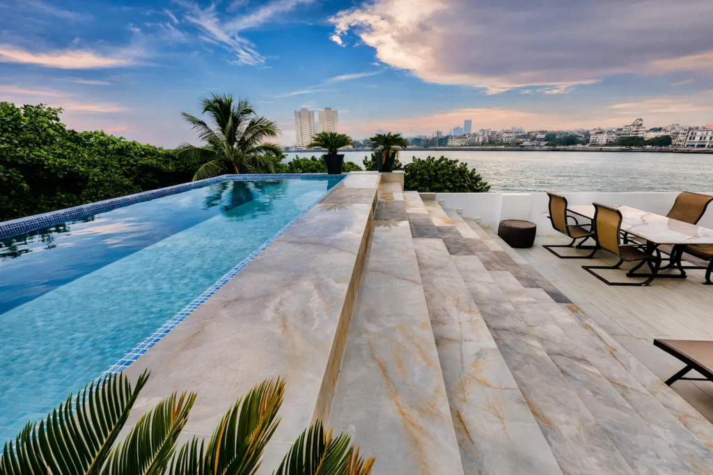 Infinity-edge pool and broad water view at Penthouse Rio Mar