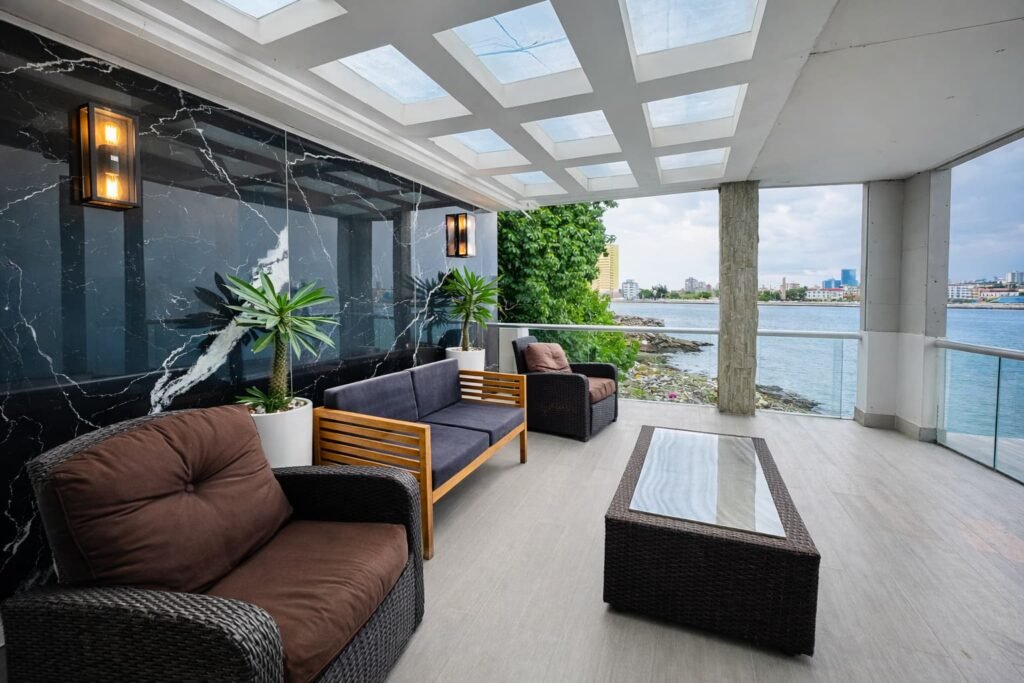 Covered outdoor lounge at Penthouse Rio Mar in Havana