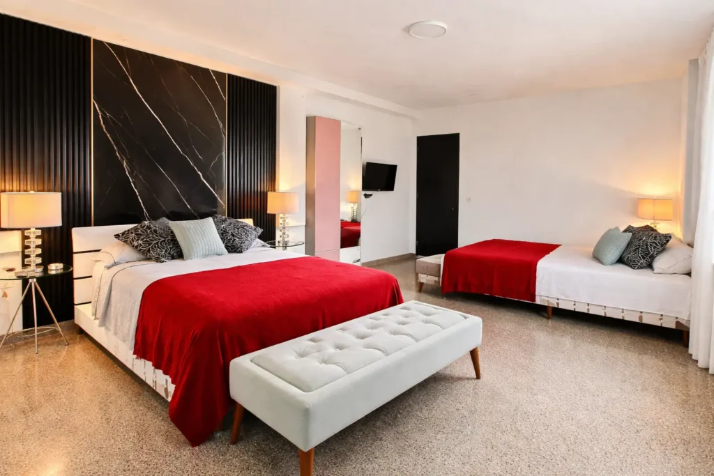 Large bedroom with two beds at Penthouse Rio Mar