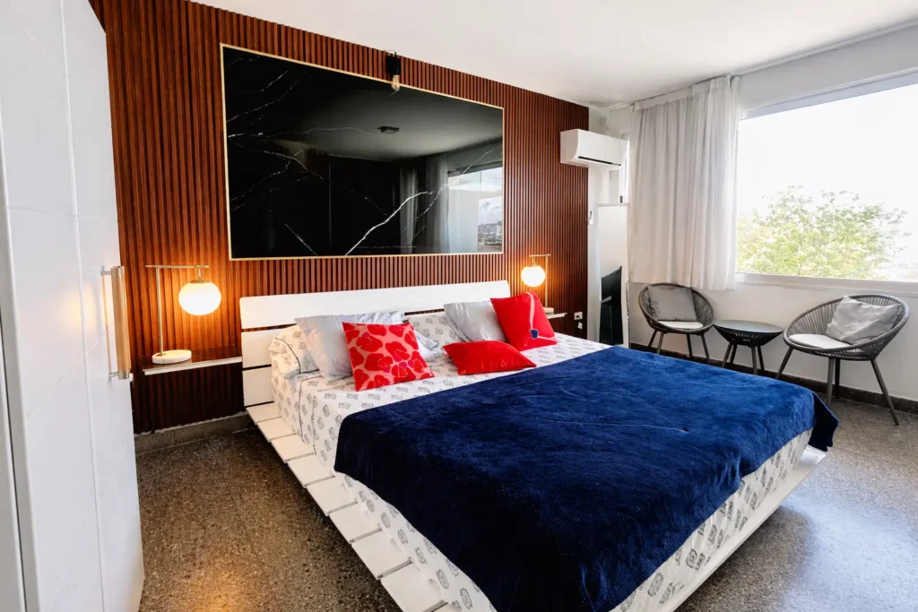 Blue bedroom with a water view at Penthouse Rio Mar
