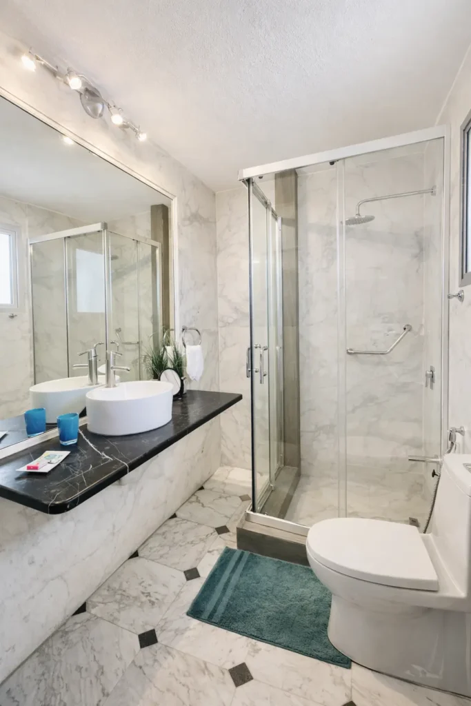 Marble bathroom with glass shower at Penthouse Rio Mar