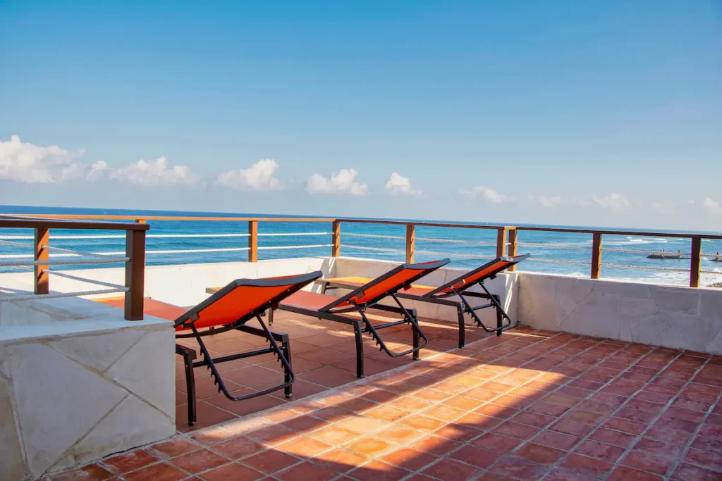 Sun loungers on a broad sea-facing terrace in Santa Fe