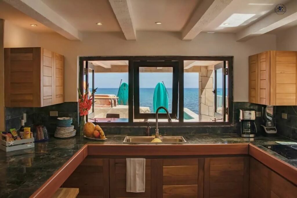 Kitchen looking toward the pool and sea at The Loft