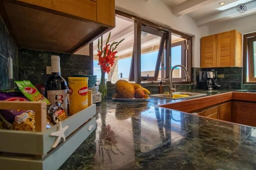 Kitchen worktop with windows toward the sea
