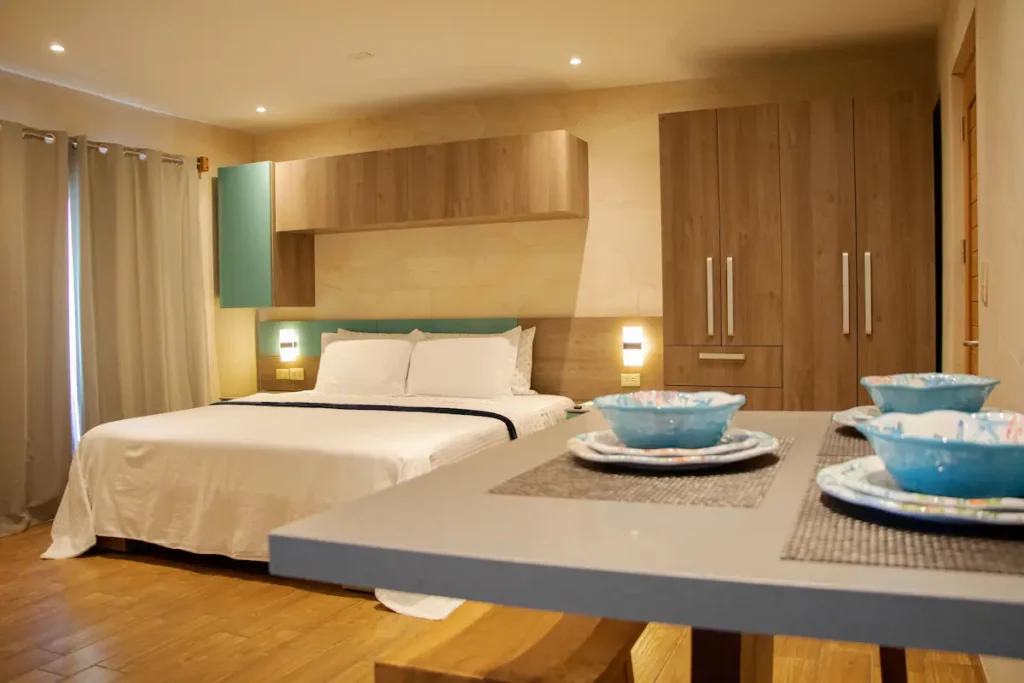Bedroom and dining space within one of The Loft units
