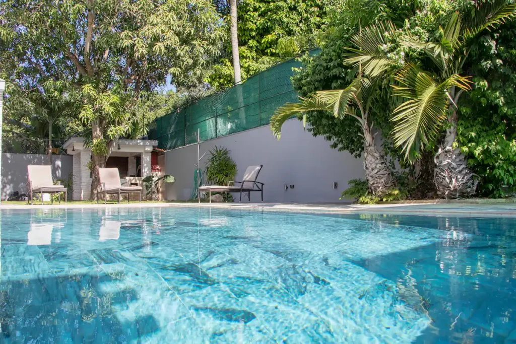 Private pool surrounded by mature planting at Villa Aurora
