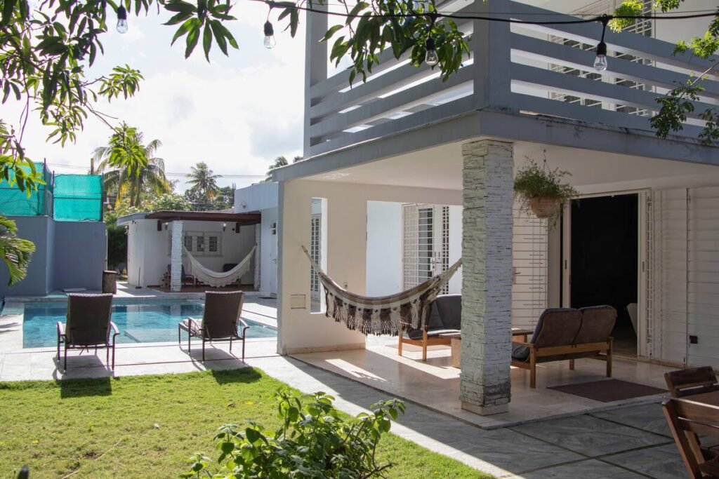 Covered garden terrace at Villa Aurora in Siboney