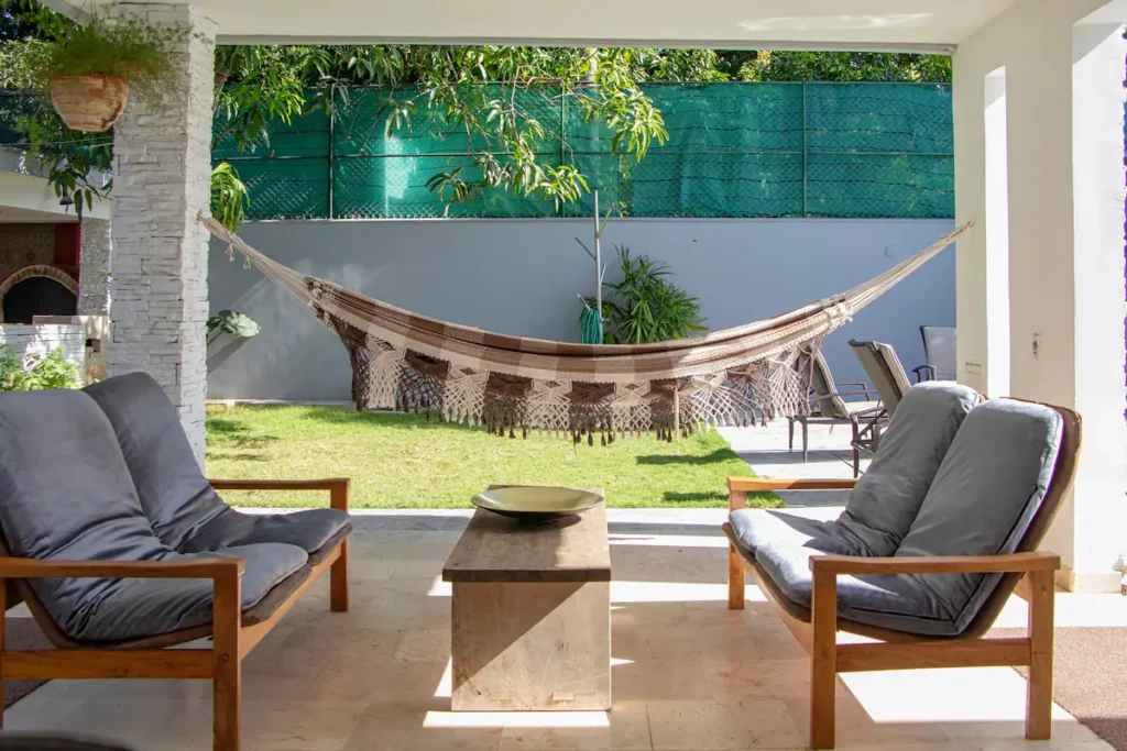 Outdoor lounge under the covered terrace at Villa Aurora