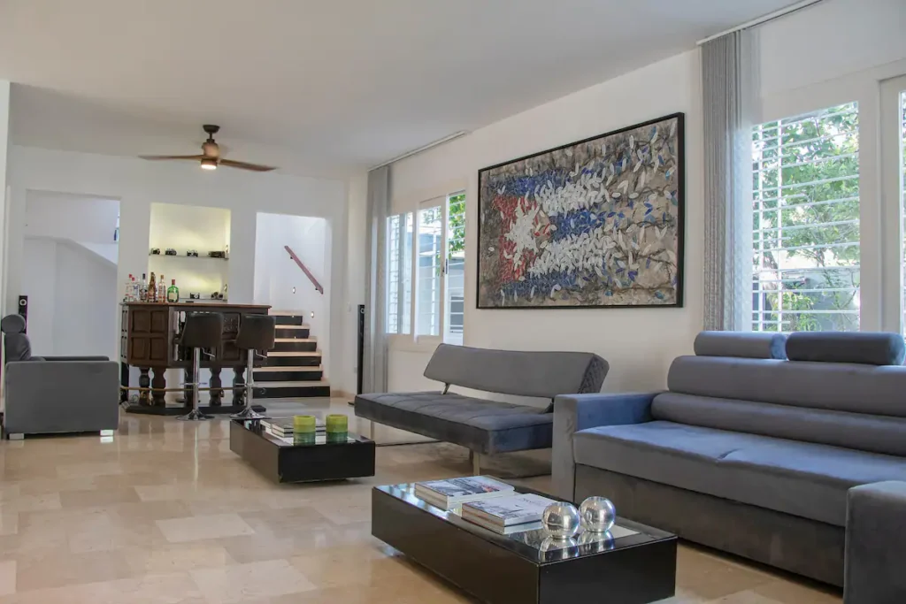 Garden-facing lounge with mid-century proportions at Villa Aurora