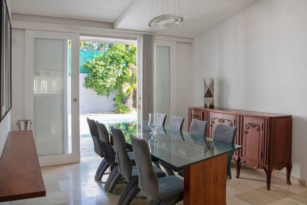 Dining room opening towards the garden at Villa Aurora