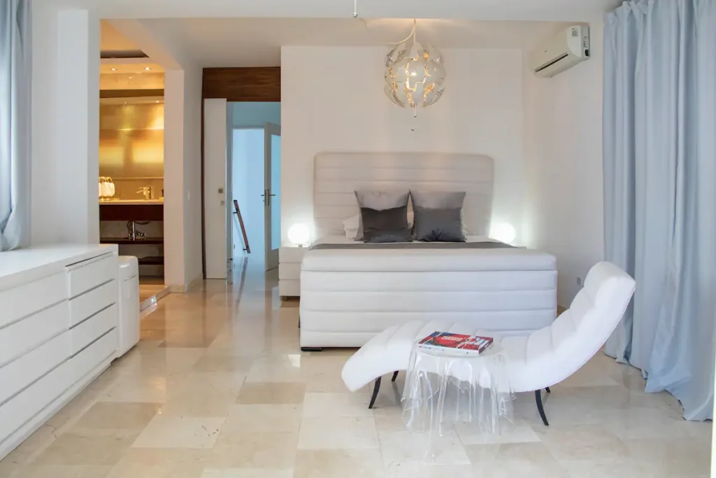 Spacious principal bedroom inside Villa Aurora