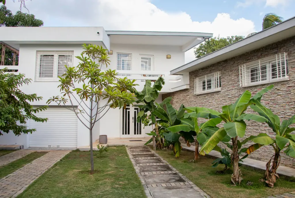 Garden facade of Villa Aurora mid-century mansion in Siboney