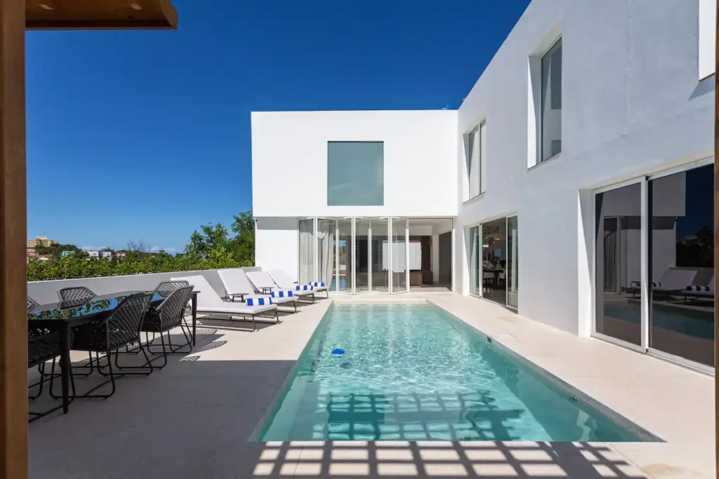 Long private pool facing the Villa Bella exterior