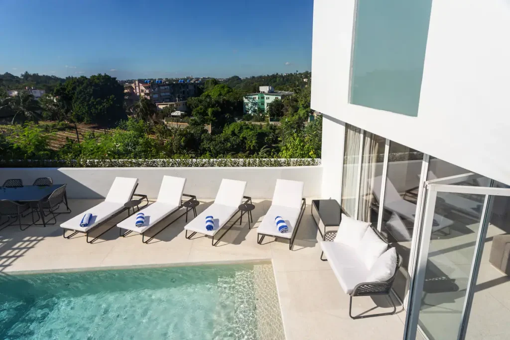 Elevated view across the pool and Nuevo Vedado greenery