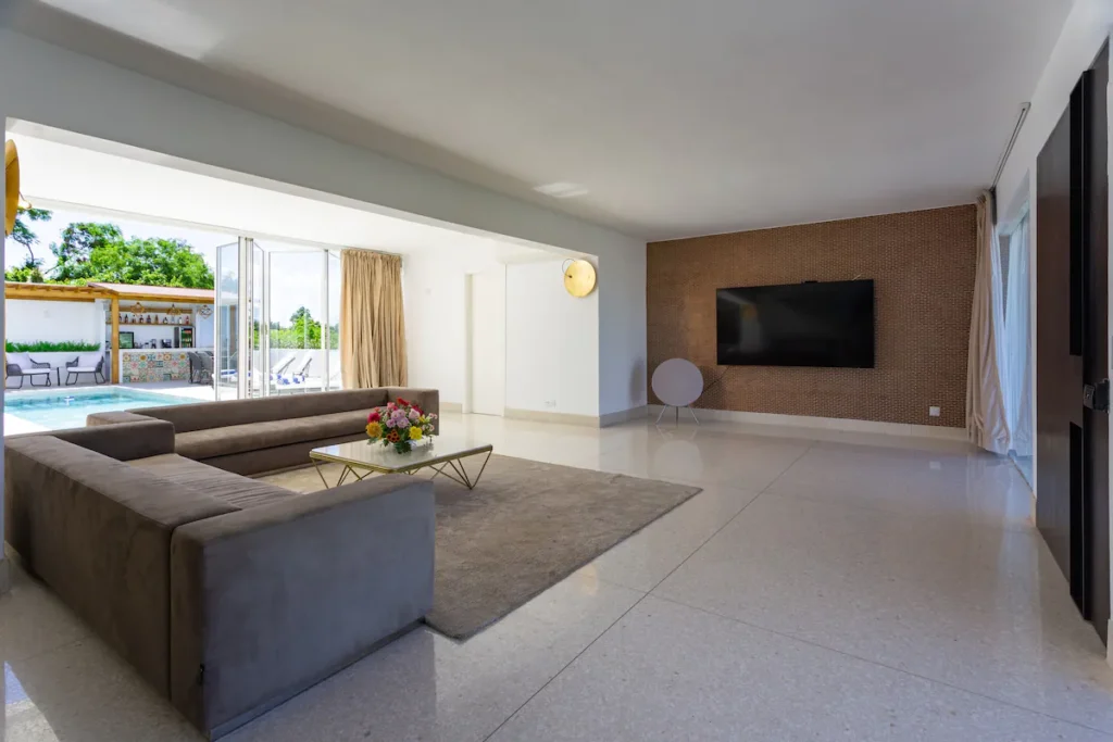 Minimalist lounge with large television at Villa Bella