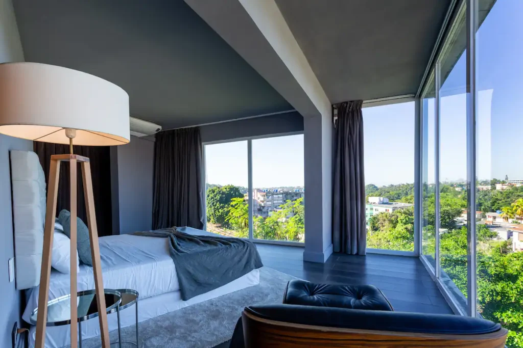 King bedroom with floor-to-ceiling windows at Villa Bella