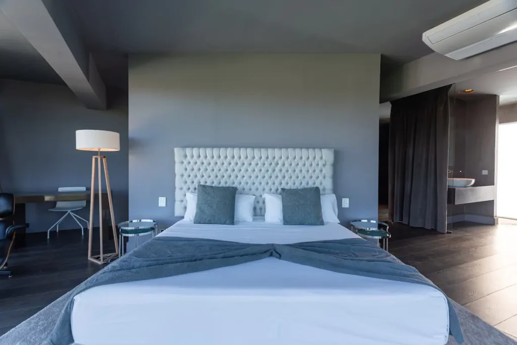 King bedroom with dark feature wall at Villa Bella