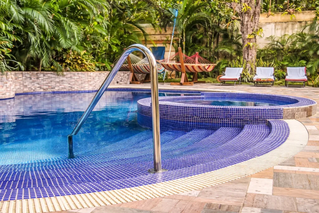 Curved steps into Villa Castle pool and jacuzzi