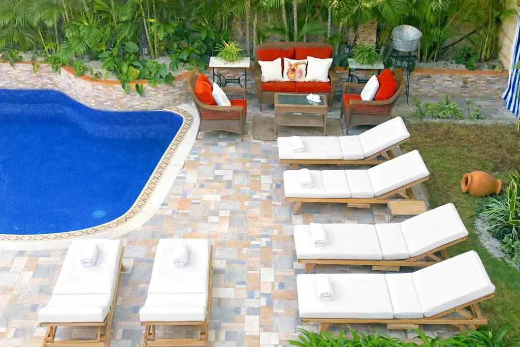 Sun loungers beside the pool at Villa Castle