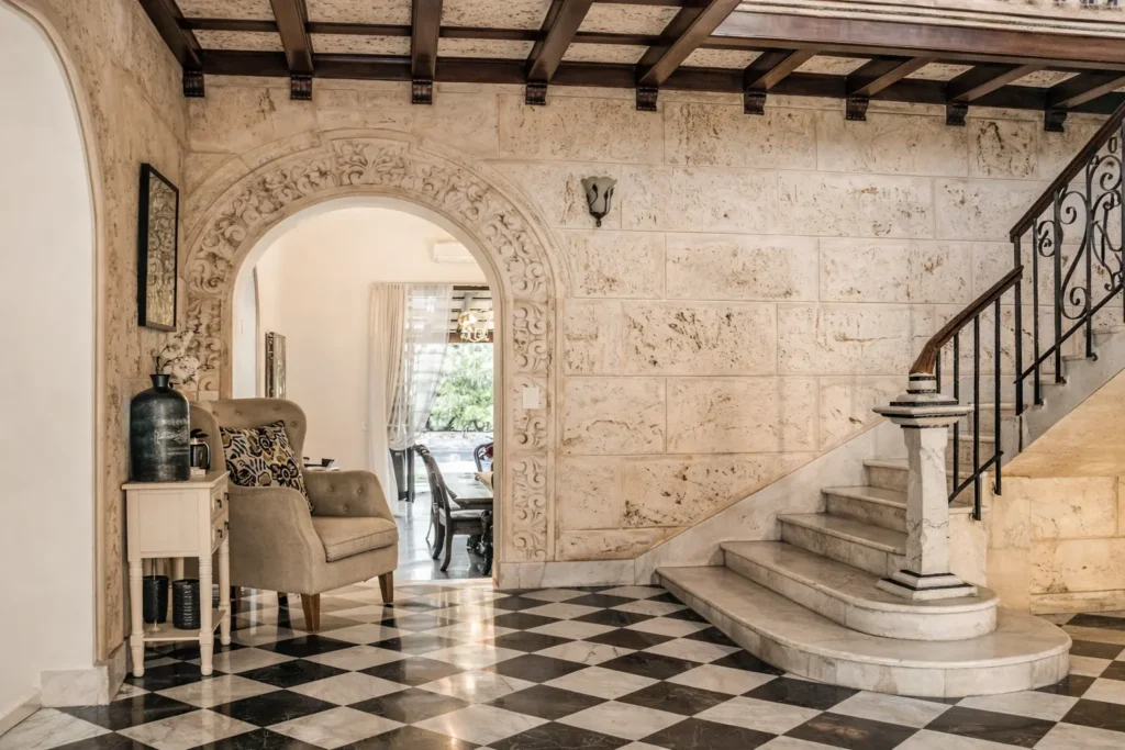 Stone interior hall and staircase at Villa Castle