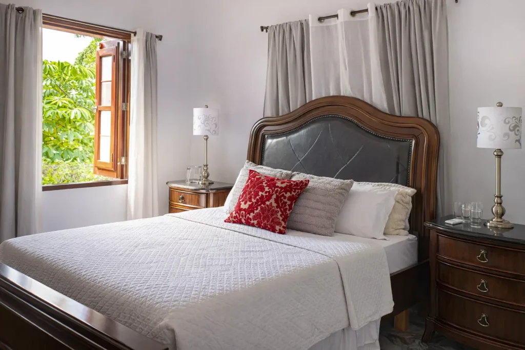 King bedroom with garden-facing window at Villa Castle