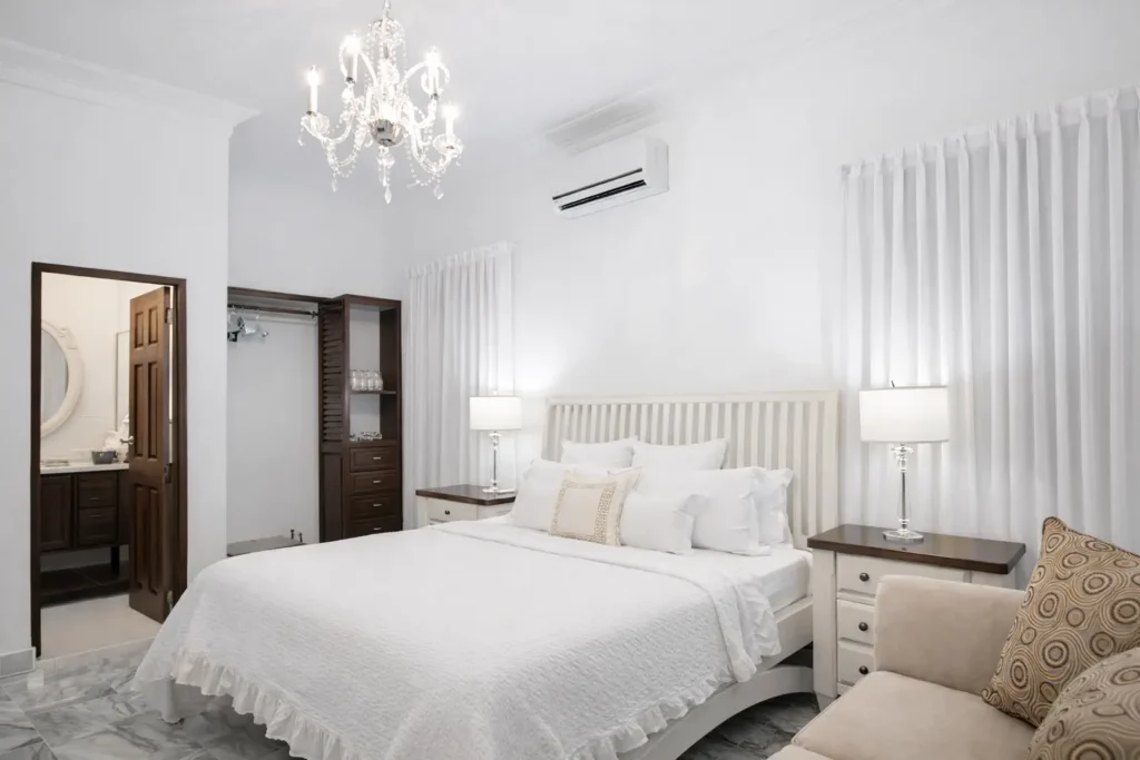 Bright white bedroom at Villa Castle in Havana