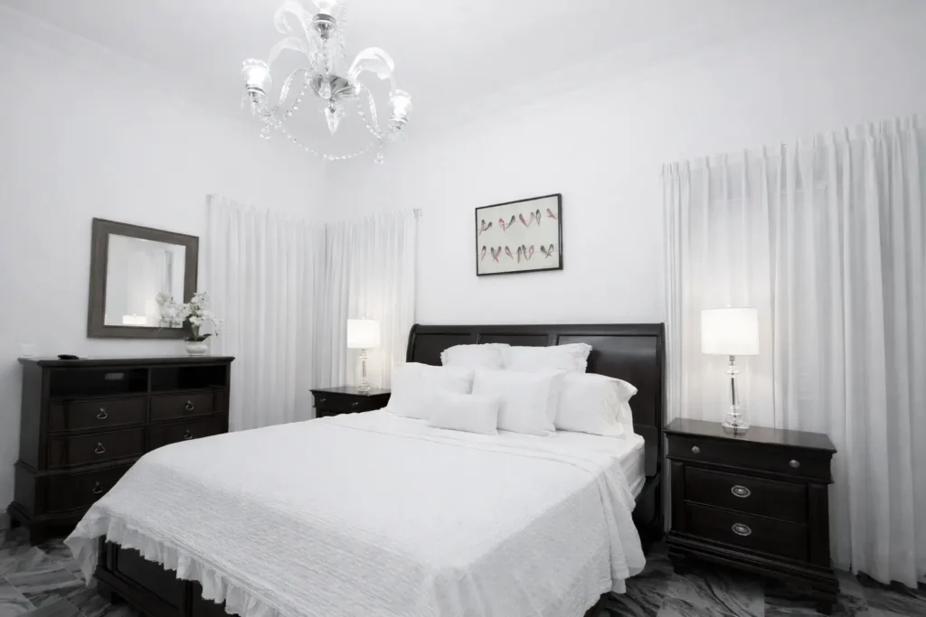 King bedroom with classic dark furniture at Villa Castle