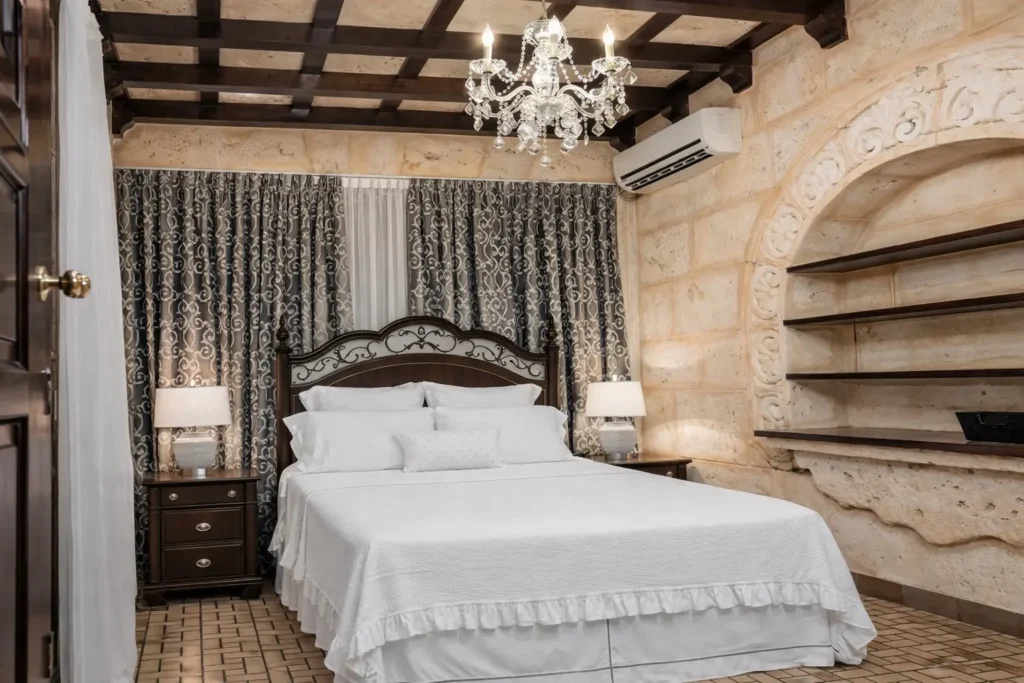 King bedroom with stone wall detail at Villa Castle