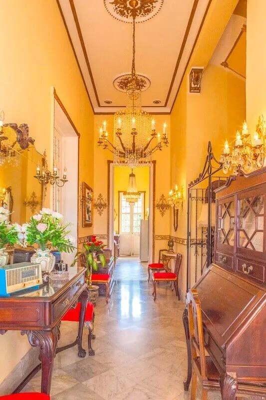 Tall entrance hall with chandelier at Villa Condesa