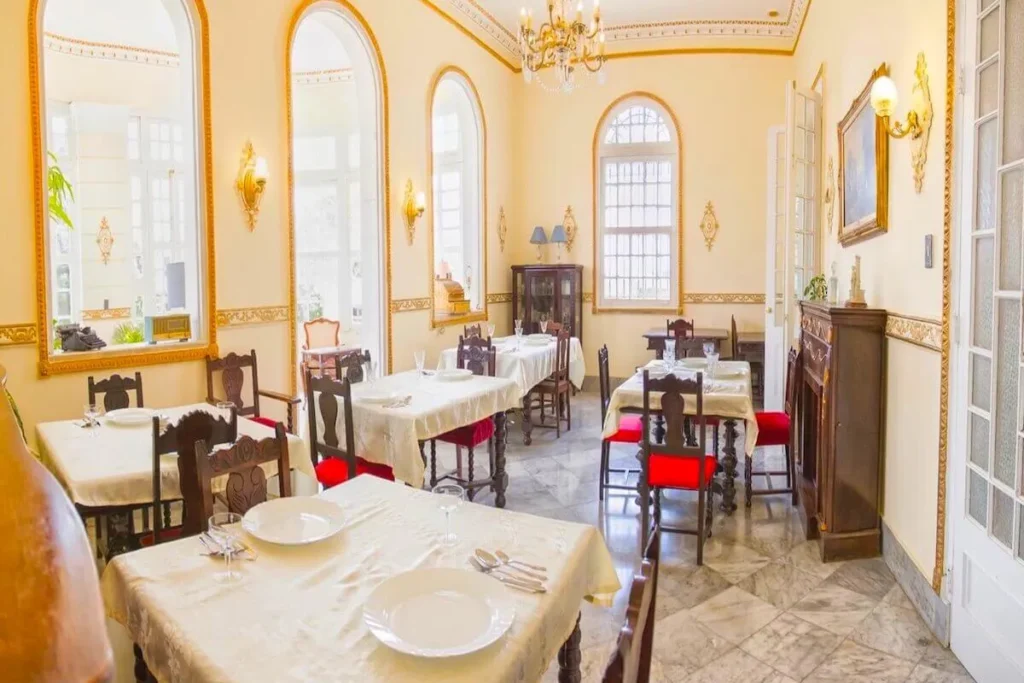 Formal dining room prepared for a group at Villa Condesa