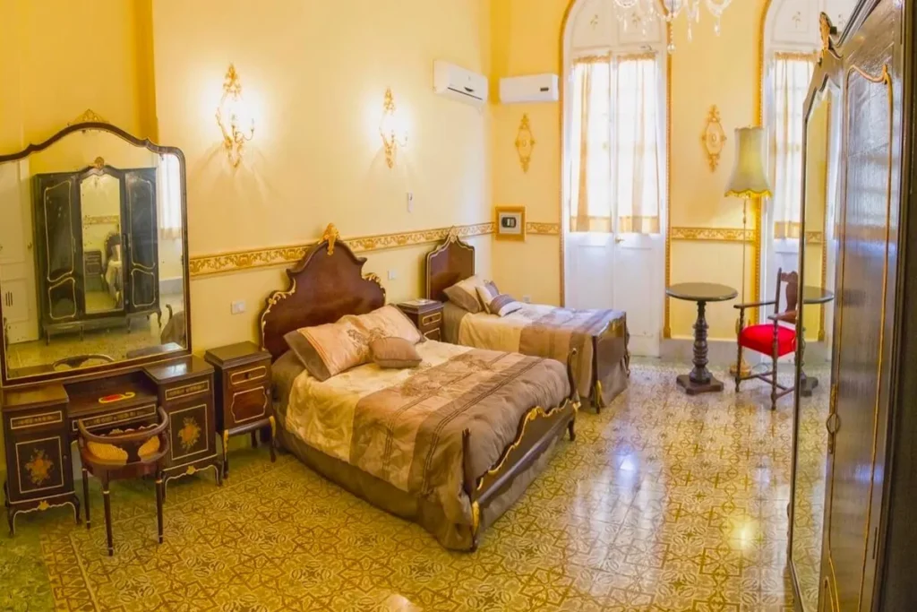 Double bedroom with additional seating at Villa Condesa