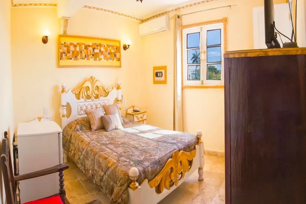 Ornate double bedroom inside Villa Condesa in Havana