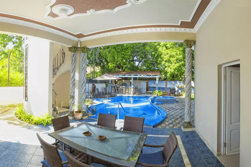Garden pool with shaded pavilion at Villa Costa in Havana
