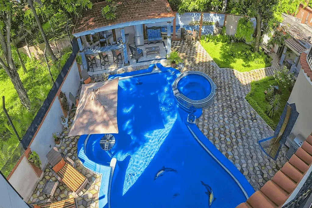 Elevated view of the Villa Costa pool within its garden