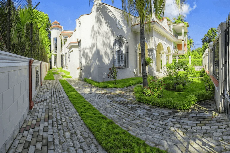 Tree-lined garden path leading to Villa Costa