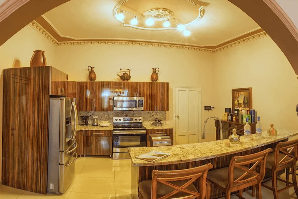 Villa Costa kitchen with timber cabinets and breakfast counter