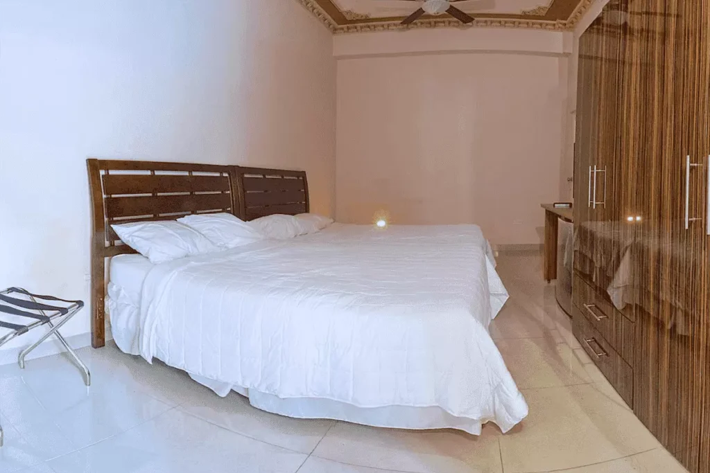 King bedroom with timber wardrobe at Villa Costa
