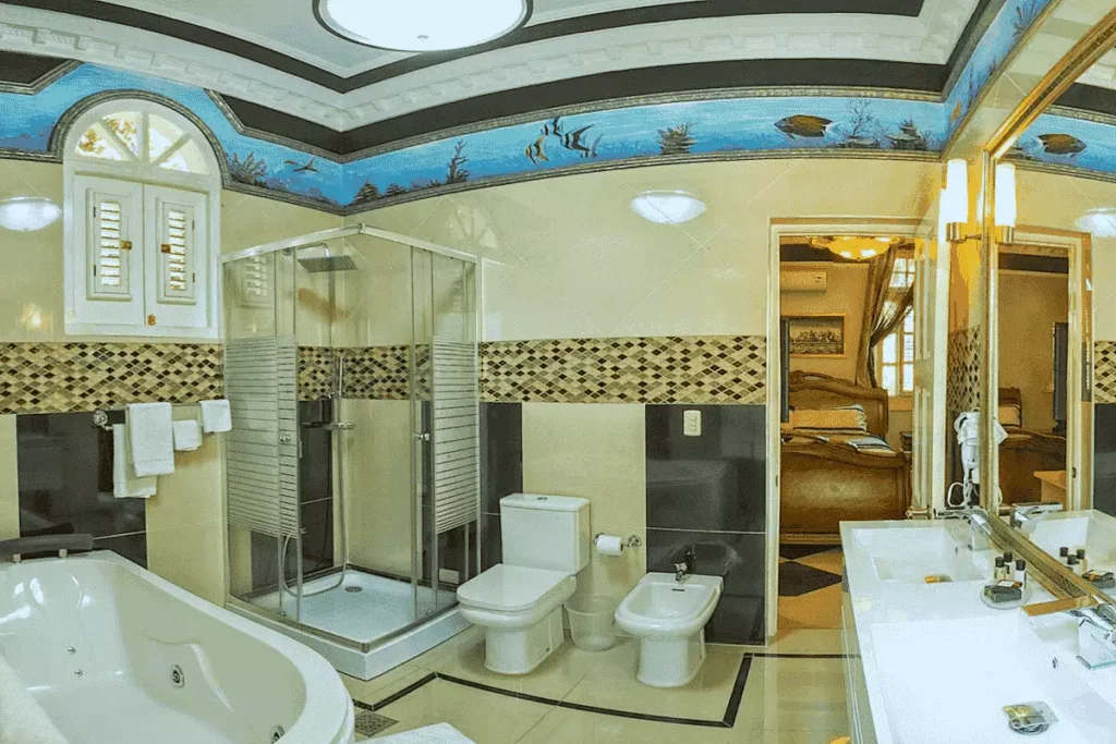 Marble-pattern bathroom with double vanity at Villa Costa