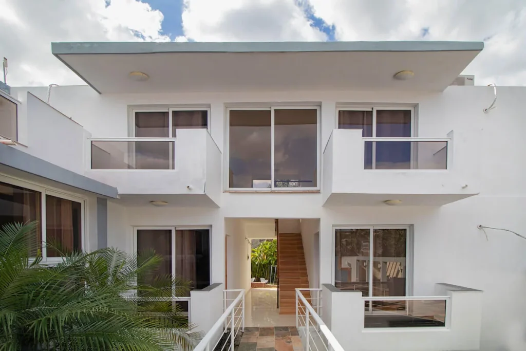 White two-storey exterior and garden entrance at Villa Don