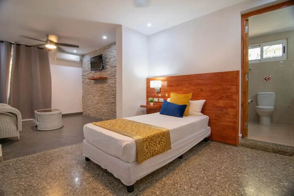 King bedroom with gold accents at Villa Don