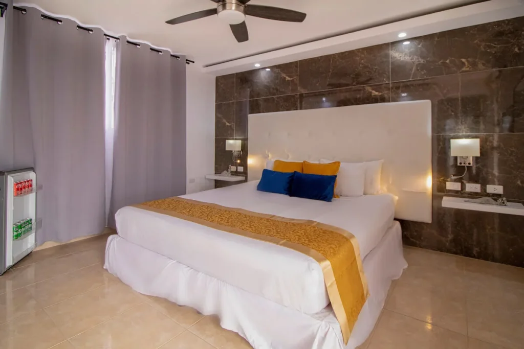 King bedroom with stone feature wall at Villa Don
