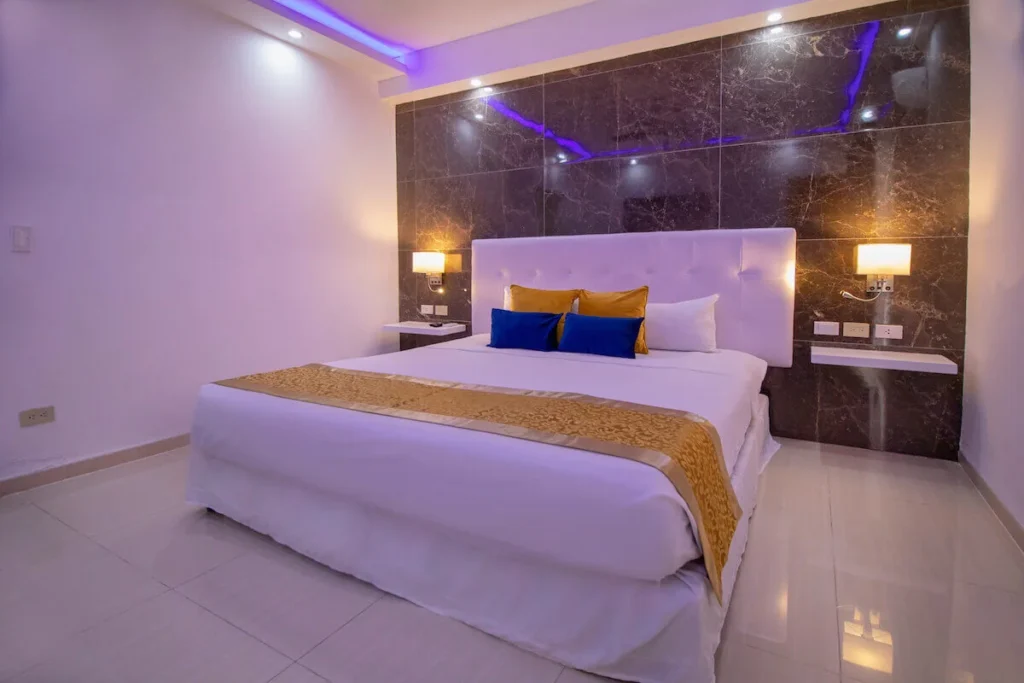King bedroom with purple accent lighting at Villa Don